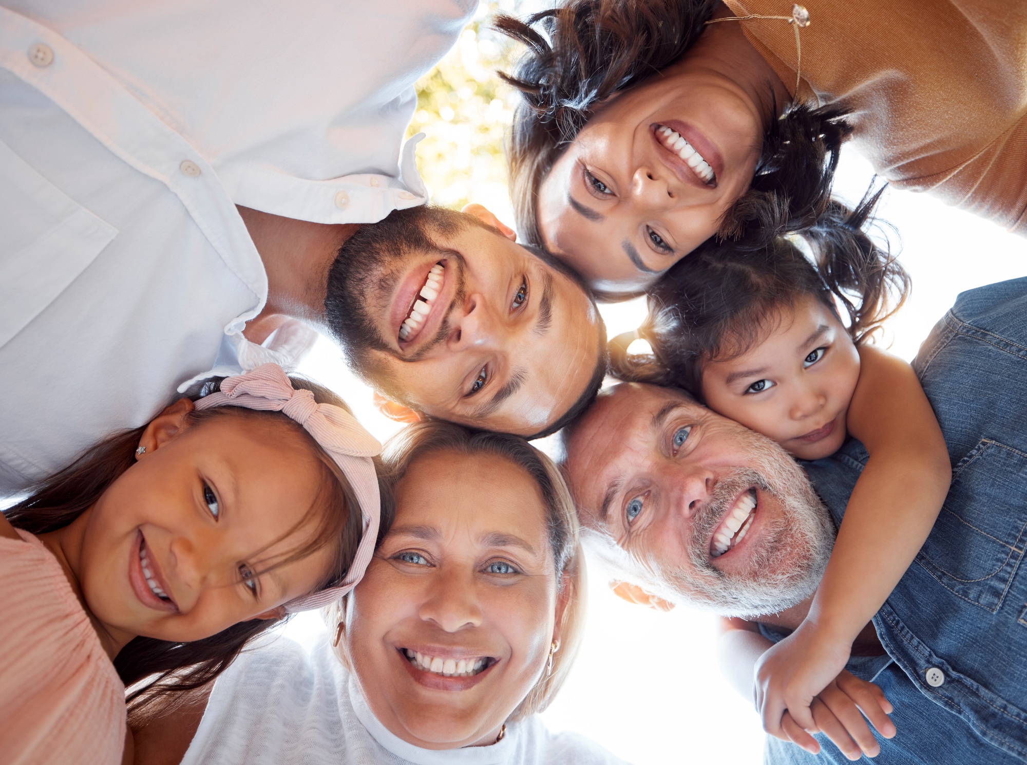 Happy, big family and portrait smile below for fun quality bonding together in the outdoors. Mother